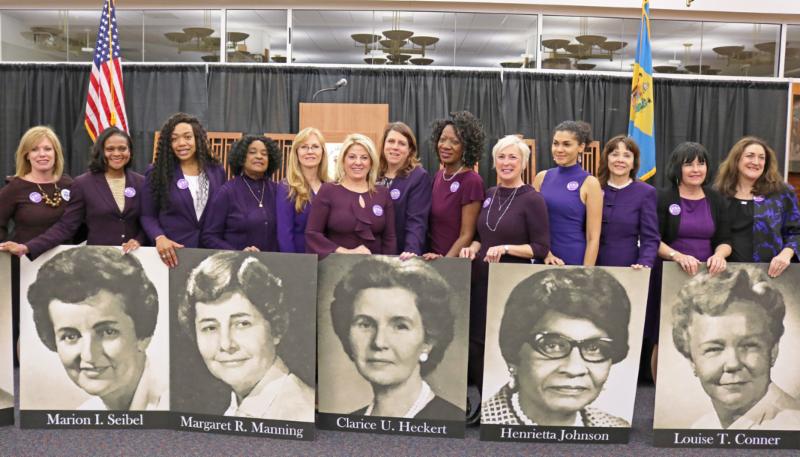 Legislators pose with the photos of former legislators who voted for an ERA amendment in 1972. Pictured are (l-r) Sen. Nicole Poore, D-New Castle; Rep. Sherry Dorsey Walker, D-Wilmington; Rep. Melissa Minor-Brown, D-New Castle, Rep. Stephanie T. Bolden, D-Wilmington, Sen. Stephanie Hansen, D-Middletown, Rep. Valerie Longhurst, D-Bear, Rep. Krista Griffith, D-Fairfax; Rep. Kendra Johnson, D-Bear; Rep. Ruth Briggs King, R-Georgetown; Sen. Elizabeth Lockman, D-Wilmington; Sen. Cathy Cloutier, R-Heatherbrooke; Rep. Kim Williams, D-Newport; and Rep. Debra Heffernan, D-Bellefonte. SUBMITTED PHOTO