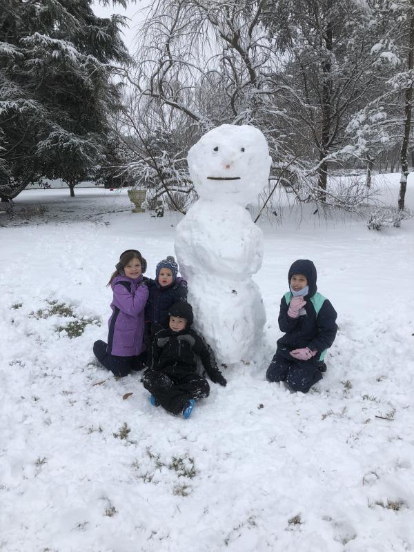 The Bonk family enjoys a visit at Izzy and Lee’s during the first snow of 2019 in Milton.