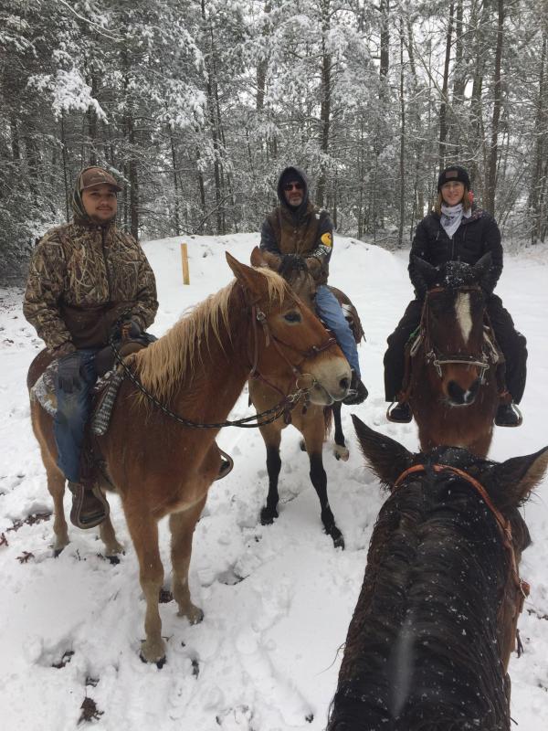 Edward Thompson, Micah Scarborough, Zoe Shockley and Annette Tomko enjoyed the snow on horseback.