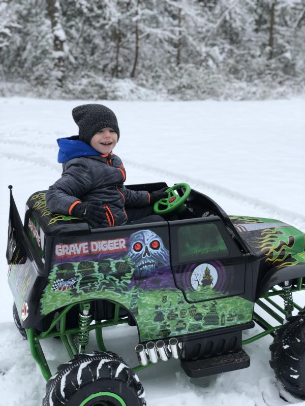 Gannon Paugh, 5, of Georgetown takes a ride in the snow.