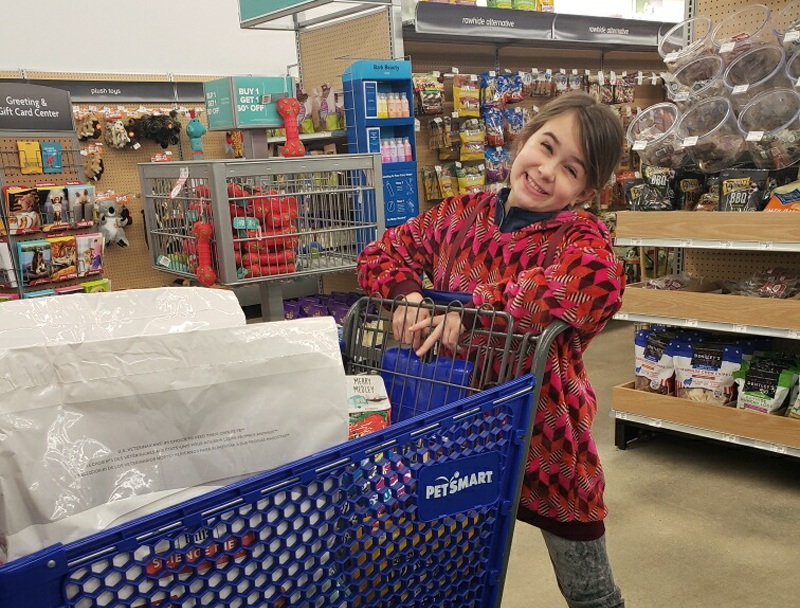 Izzy shops at PetSmart with donated money.