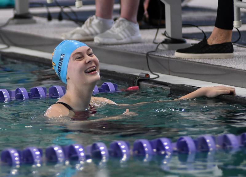 Cape’s Heidi Simmons looks up to her family after swimming a 2:14.96 fifth-place finish in the 200 freestyle.