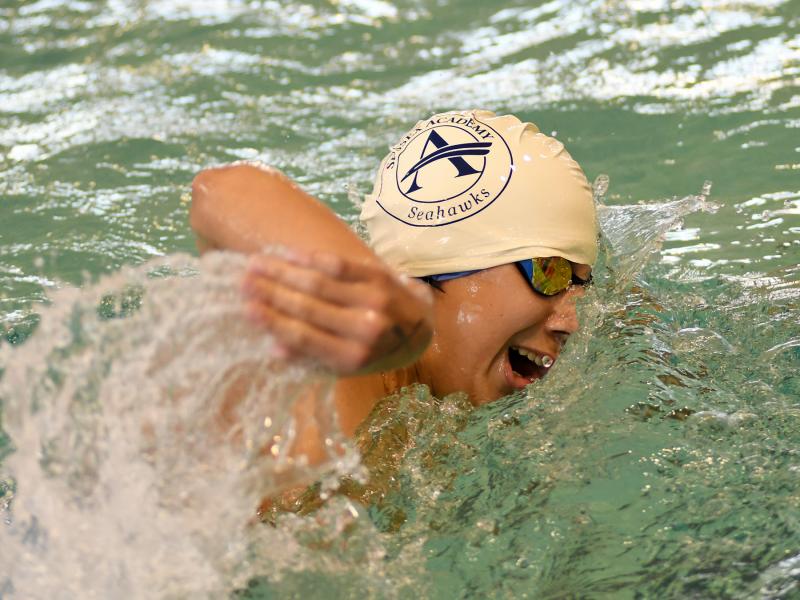 Sussex Academy freshman Tyler Burger swims to an eighth-place finish in the 500 free with a time of 5:55.96.