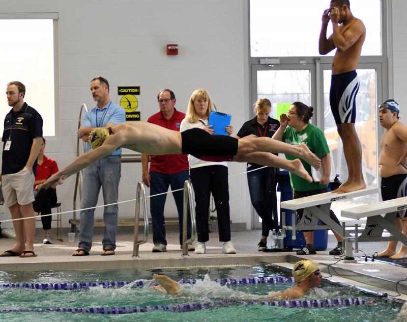 Miford’s Ben Sobota leaves the blocks after teammate Stone Davis touches up in the 200 free relay. They placed fifth in 1:39.78. Sobota is the grandson of former Cape science teacher Al Campo.