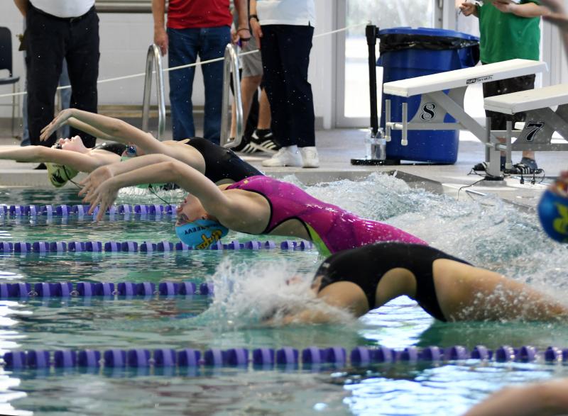 Cape senior Madelyn McGreevy leaves the blocks in the 100 backstroke. She took the bronze medal in 1:04.44