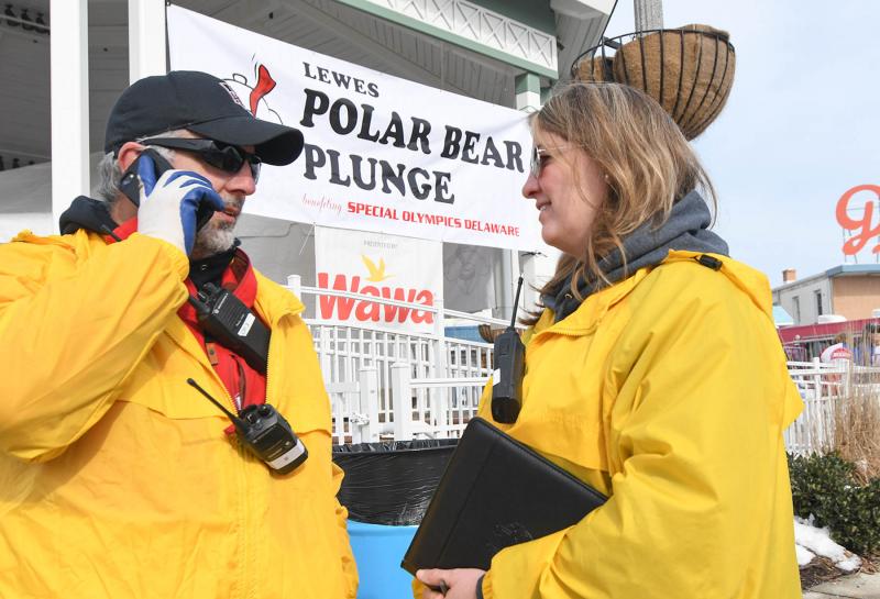SODE staff members Gary Cimaglia and Lisa Smith go over last minute instructions for the plunge. DAN COOK PHOTO