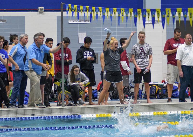 Cape coaches (l-r) Pete Olson, Bill Geppert and Kristina Lingo cheer on their 400 free relay team.