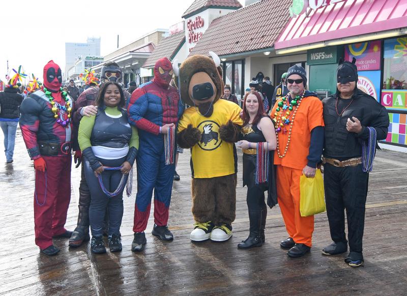 There were lots of superheroes on hand for the plunge. The Delaware Department of Corrections-Correctional Plungers are (l-r) Tim Martin, Josh Wolstrom, Sarah Wolstrom, Roger Raney , Buffalo Wild Wings Mascot Jester, Samantha Wright , Mike Little and Bruce Morris. DAN COOK PHOTO
