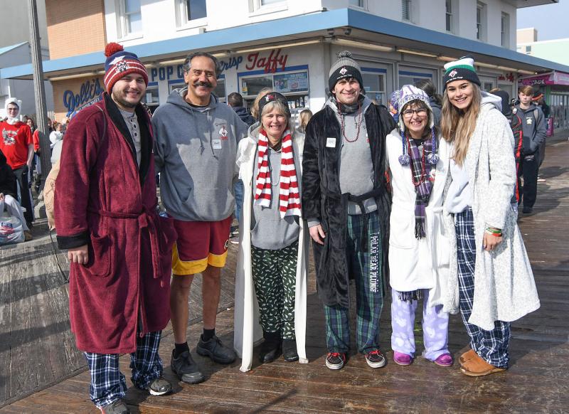 The Avelleyra family plunges each year. Shown are Nicholas, Michael and Diane Avelleyra, Tom Nichols and Elizabeth Avelleyra. DAN COOK PHOTO