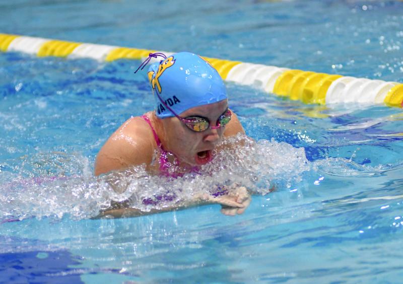 Cape junior Gianna Vayda swims the breaststroke leg of the medley relay.