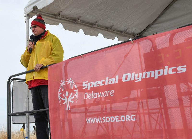 SODE Director of Media Relations and Program Innovations Jon Buzby welcomes the crowd to the 2019 Polar BVear Plunge to benefit Special Olympics Delaware. DAN COOK PHOTO