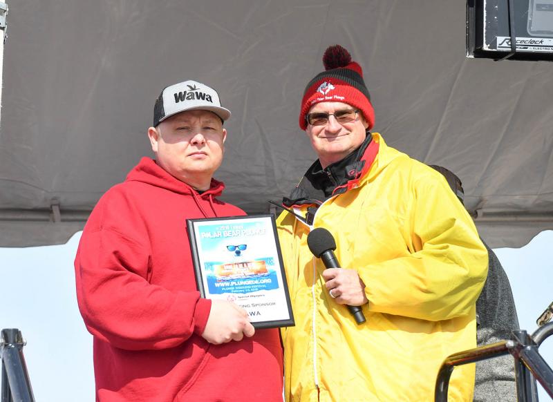 Wawa manager Dan Mills, left, receives a plaque of appreciation from SODE Director of Media Relations and Program Innovations Jon Buzby. DAN COOK PHOTO