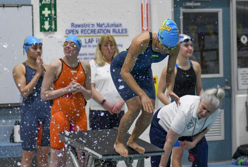 Cape’s Amaya Daisey awaits the touch of Erin Morrissey in the 200 free relay.
