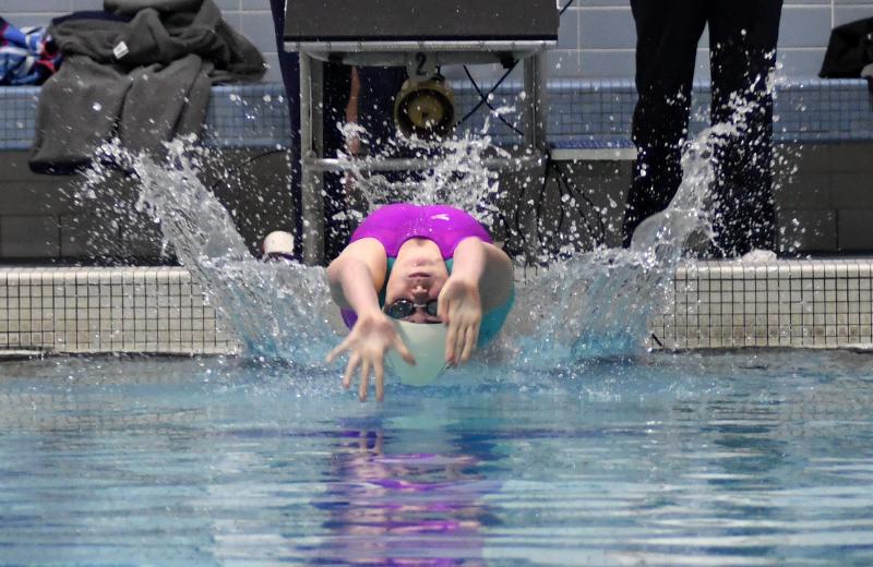 Sussex Academy’s Tess Mariner swims to 15th in the 100 backstroke with a time of 1:04.82.