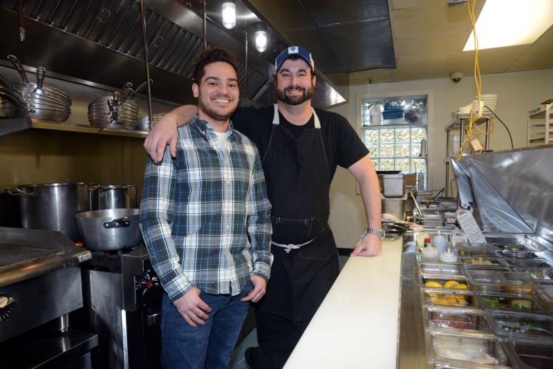 Manager Miguel Batiz and chef Bill Clifton pause, on their grand opening day, for a photo in the newly-outfitted kitchen. The Counting House