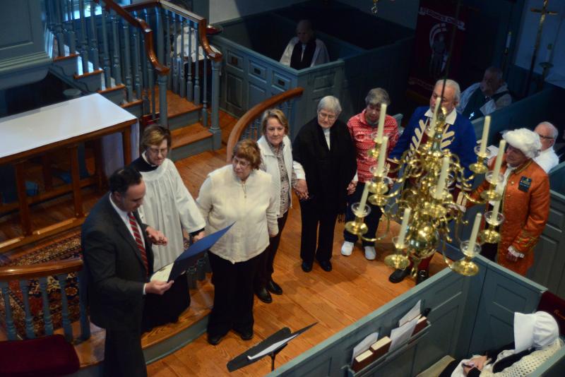 Sen. Ernie Lopez, R-Lewes, reads a proclamation to the vestry and congregation during the Heritage Sunday service. Shown are (l-r) Lopez, the Rev. Mariann Babnis, Senior Warden Anne Ameigh, Lisa Graff, Helen Abrams, Barbara Betts, J.B. Walsh and Jim Horn. St. Georges 300th