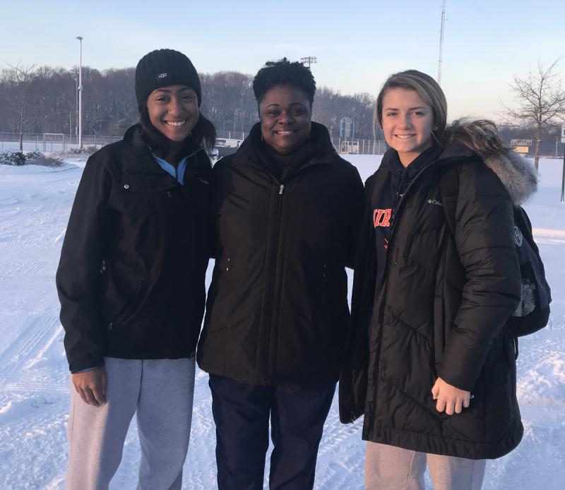 On Feb. 2, Tranesha “Ladybug” Savage, Cape’s indoor 400-meter record holder, wished Cape’s two 400 runners good luck before they left for the indoor state championships. Shown are (l-r) freshman Tia Jarvis, Savage and Alia Marshall, who would break Savage’s record later in the day. TIM BAMFORTH PHOTO