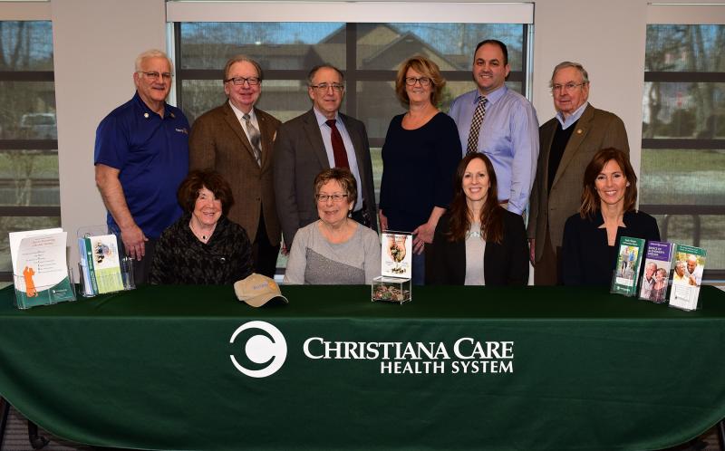 DAN COOK PHOTOS
Celebrating the gift presentation are in back ( l-r) David Keller, director, Lewes-Rehoboth Rotary Club, Swank Leadership Council, Christiana Care; Robert Reed, chair, Swank Leadership Council; James Ellison, MD, endowed chair, Swank Memory Care Center, Christiana Care; Carlene Roach, Georgetown-Millsboro Rotary Club; Jason Bentley, president, Lewes-Rehoboth Rotary Club; and Michael South, Lewes-Rehoboth Rotary Club. In front are Judy Kirkland, Swank Leadership Council; Georgiann Deist, Lewes-Rehoboth Rotary Club, Swank Leadership Council; Michelle Ritona, FNP-BC, Swank Memory Care Center; and Jennifer Rittereiser, MPH, Swank Memory Care Center.