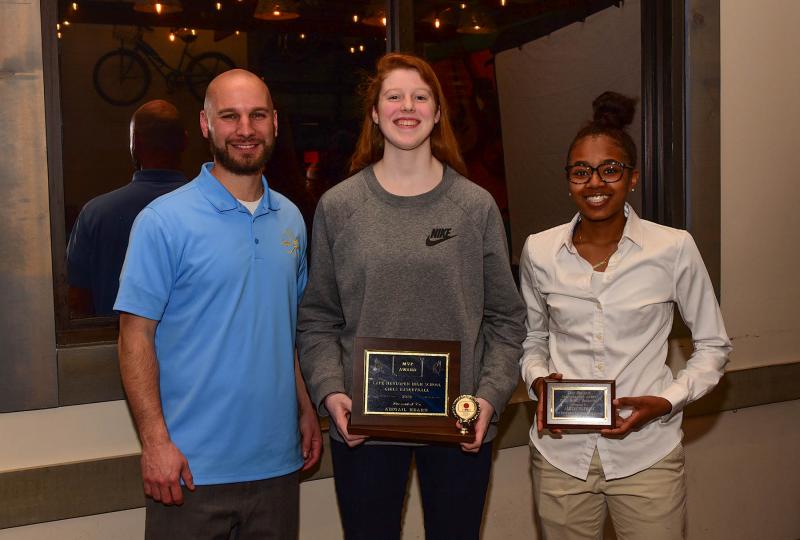 Henlopen Conference Coach of the Year Pat Woods, left, poses with team MVP Abbey Hearn and Lexi Watkins, the team Sportsmanship Award recipient. DAN COOK PHOTOS