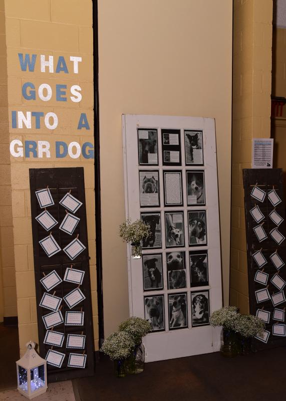 Lennea Hoban created this Giving Wall of photos of dogs that are heartworm positive and are currently going through treatment which is paid for by GRR. The cards on the shutters contain sponsorship opportunities for various supplies and veterinary procedures.