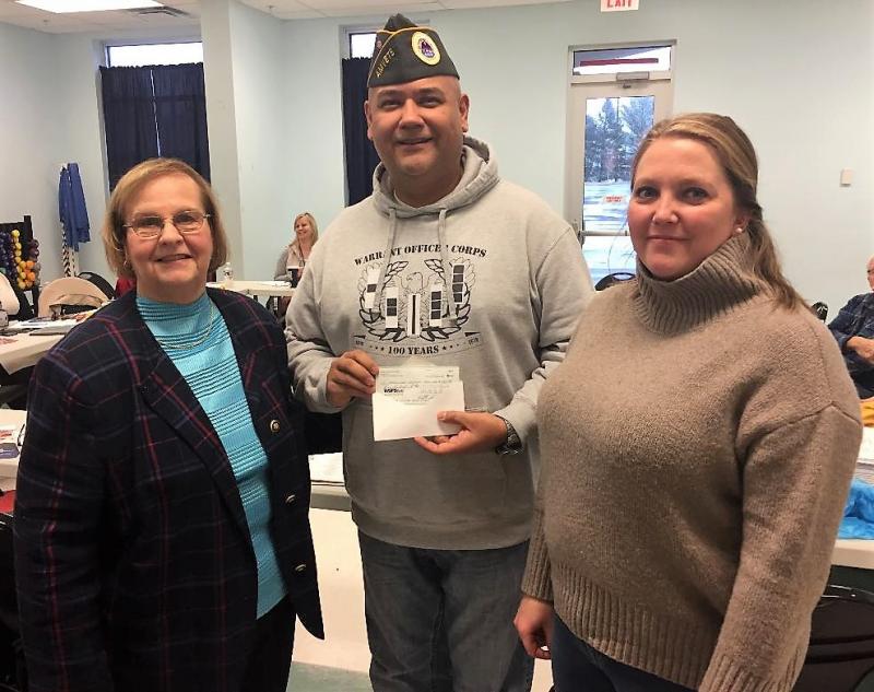 Presenting a check for $500 is Marc Garduno, center, AMVETS Post 8323, to Stand Down organizers Liz Byers-Jiron, left, and Amber Lara. SUBMITTED PHOTOS
