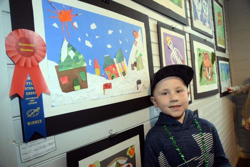 Charles Gibson III, “Trey,” a first-grader from Lord Baltimore Elementary, was awarded an honorable mention cash prize from the Howard Pyle Studio Group for his collage and tempura city scene. Young at Art
