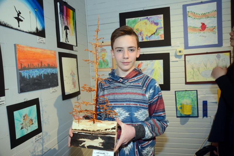 Nathanael Taylor, an eighth-grade student from Delmarva Christian School, won an Award of Excellence cash prize from the Village Improvement Association for his copper wire and wood-burning artwork. Young at Art