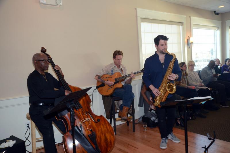 The Carey Smith Trio kept the music going during the event. Shown are (l-r) Wes Biles, Carey Smith and Andrew Bedell. CRC Seeds of Change