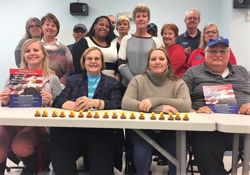 With their ducks in a row, Stand Down organizers are (l-r) Beth Tarrant, Elks; Gary Kalmus, veterans outreach; Ryan Poulsen, VA homeless program; Gail Gartner, Department of Labor; Ron Garcia, registration; and Dan Davis, American Legion Auxiliary. In the middle are Beth Rosebrooks, logistics; Suzzette Moore, co-chair, VA regional office; Donna Lawson, secretary; Nancy Bush, American Legion Auxiliary; and Di Davis, American Legion Auxiliary. In front are Mindy Bacchus, Dress for Success; Liz Byers-Jiron, director; Amber Lara, treasurer; and Bill Jiron, public affairs.