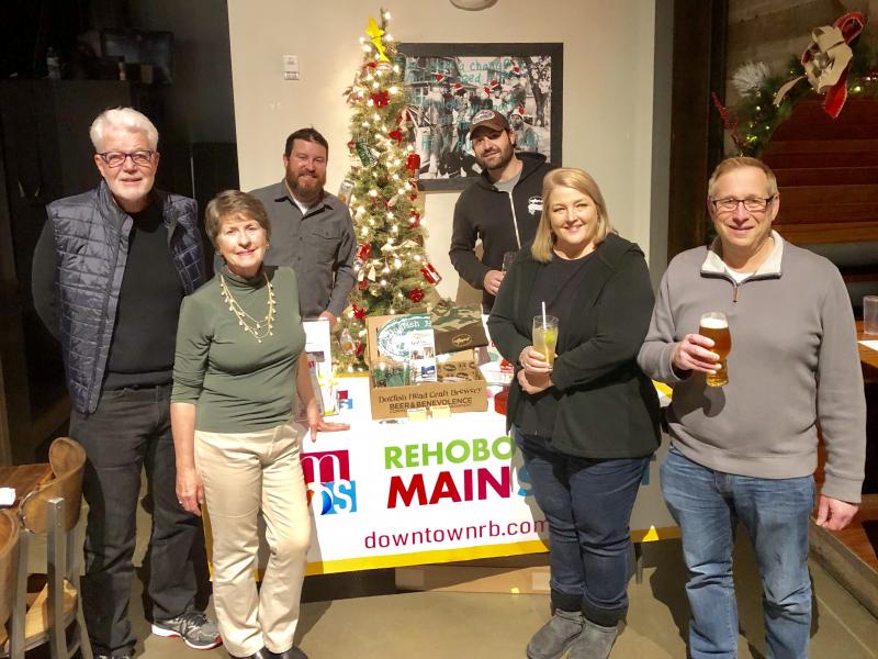 Joining Dogfish Head and Rehoboth Beach Main Street for Beer & Benevolence Night are (l-r) Richard Byrne, Rehoboth Beach commissioner; Cindy Lovett, Rehoboth Beach Main Street board member and chair of the design committee; Adam Newman, Rehoboth Beach Main Street board member, chair of the promotion committee and owner of Rehoboth Ale House; Ryan Schwamberger, Rehoboth Beach Main Street board member, chair of the economic vitality committee and general manager of Dogfish Head Brewings & Eats; Jenny Burton, Rehoboth Beach Main Street board vice president, downtown property manager and executive director of Big Fish Charitable Foundation; and Jeff Balk, owner of Snyder’s Candy, and general manager and morning host of Radio Rehoboth. SUBMITTED PHOTO