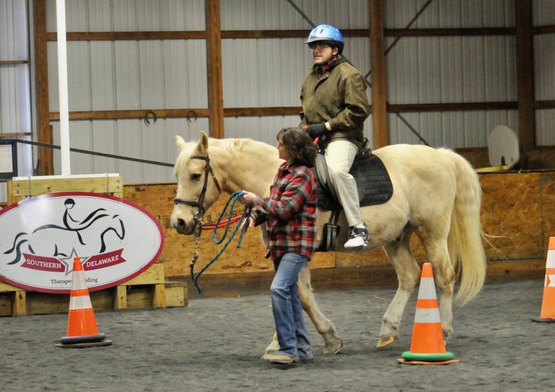 Southern Delaware Therapeutic Riding’s Kelly Boyer leads Anthony LaRose on Willy. RON MACARTHUR PHOTO