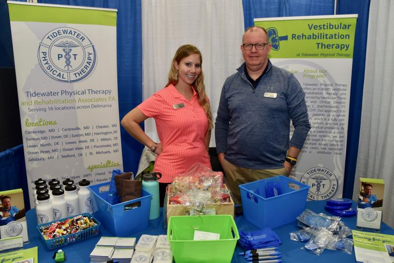 Jenna Tryon, doctor of physical therapy and clinic director, and Tye Webb, physical therapist assistant, man the Tidewater Physical Therapy booth. The clinic is located off Old Orchard Road in Lewes.