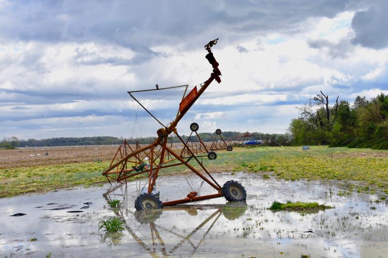 An irrigation system near Laurel is twisted in a large puddle of water left over from the storm. RON MACARTHUR PHOTO