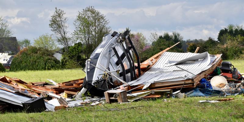 An overturned boat is completely uncovered inside a destroyed barn along Firetower Road near Laurel. RON MACARTHUR PHOTO