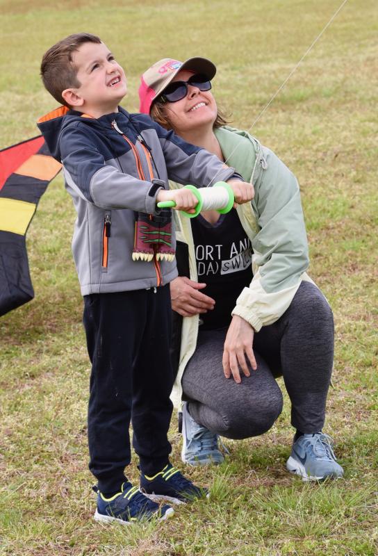With a little help from mom Susanne, Leon Brooks is a kite flyer. They came to the festival from Crofton, Md.