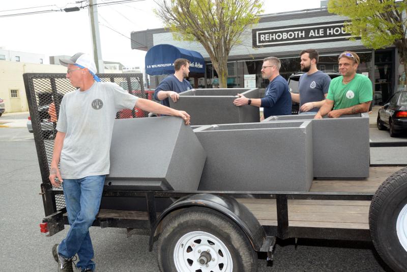 Volunteers from Henlopen Landscaping and The Pines restaurant deliver planters along the beach blocks of Wilmington, Baltimore and Rehoboth avenues. Shown are (l-r) Henlopen Landscapings’ Bill Marshall, The Pines’ Tyler Townsend, Bob Suppies, Vadim Karpershor and Henlopen Landscaping owner Jeff Gonce. Rehoboth in Bloom
