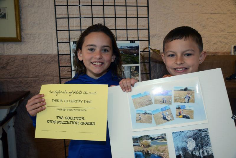 Recipients of the certificate, The Solution - Stop Pollution Award, for their photos of cleaning up trash are Jiyanna, left, and Kayden Holt. Epworth plastic awareness