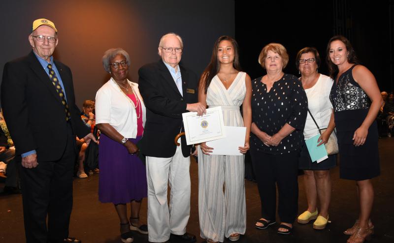 Nicole Aikens, center, is shown with (l-r) Joe Smith, Midway Lions Foundation; Dr. Joyanne Murphy, All Saints’ Episcopal Church; Harry White, Midway Lions Foundation; Janet Ray, All Saints’ Episcopal Church; Maureen Keeney, Zwaanendael Women’s Club; and Cape Principal Nikki Miller.