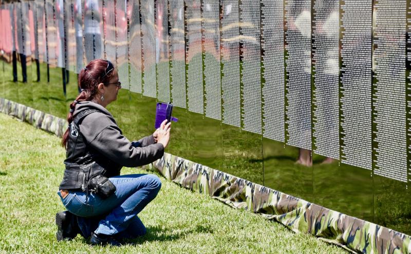 Kathy Buckingham of the Millsboro area snaps a photo of the wall. She was a member of the Free Riders motorcycle group who provided an escort for the wall into Lewes.
