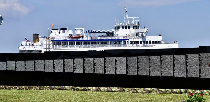 The Cape May-Lewes Ferry provides a backdrop to a small section of the Vietnam Veterans Moving Wall.