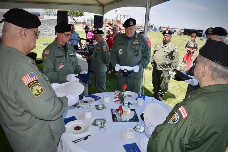 A honor guard conducts the moving five-hat ceremony to honor those in the five branches of the Armed Services who are missing in action or were killed in action.