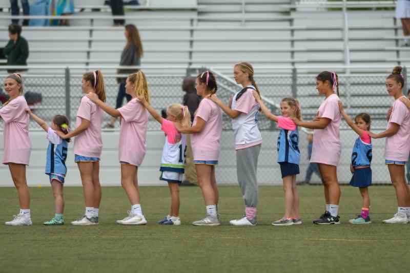 Youth players warm up with Cape varsity and are introduced before the game.