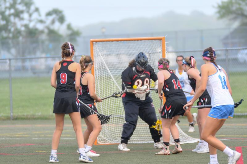 Goalie Carleigh Knotts juggles the ball to gain control.