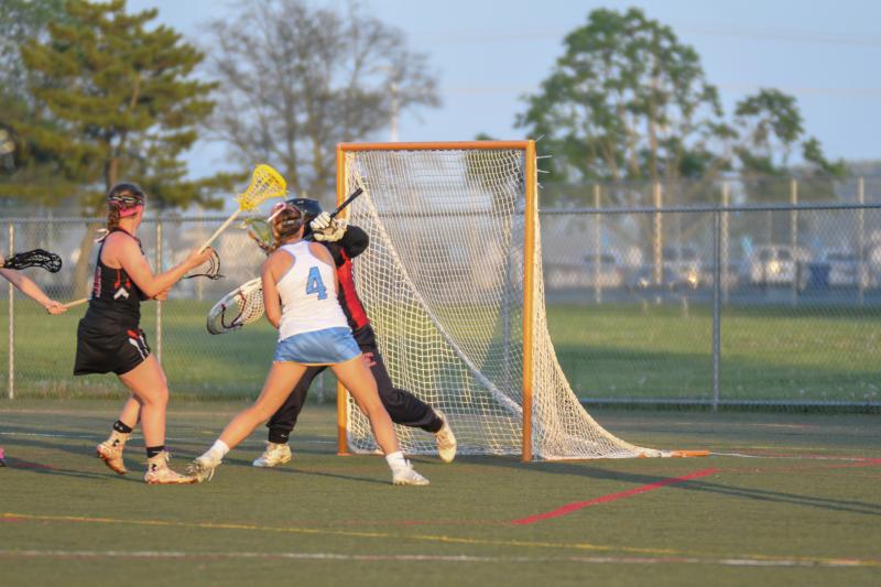 Kelly Bragg is stopped by goalie Carleigh Knotts.