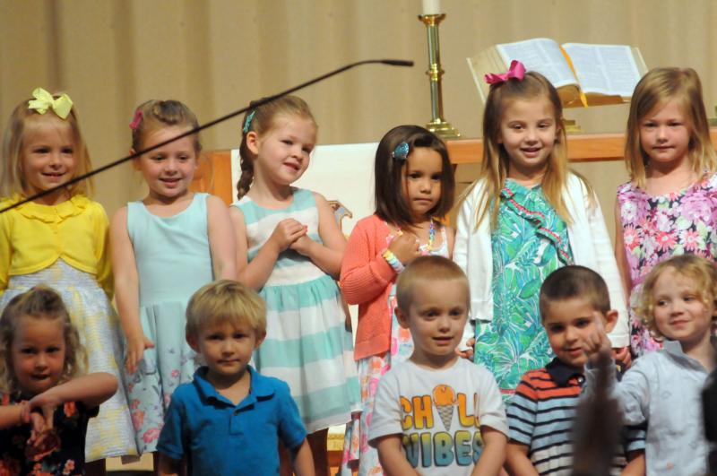 The Dolphin class performs for the gathered families. Shown in back are (l-r) Sonoma Antos, Lacy Burbage, Laityn Napolitano, Lucy Tryon, Helena Ryan and Caroline Mallon. In front are Sora Monroe, Charlie Jackewicz, Zeke Walker, Amadeo Caligiure and Oliver Riolo. Epworth Preschool Graduation