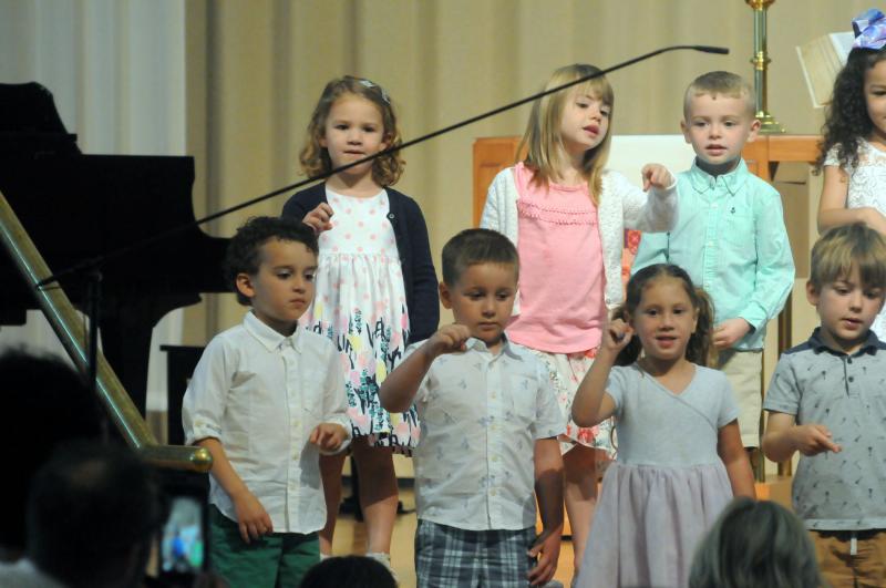 The Owl class uses American Sign Language and sings the alphabet song. Shown in back are (l-r) Audreigh Kastor, Aubrey Wilson, Tristan Farral and Layla Dowdell. In front are Ben Forrest, Henry Spillman, Vienna Mento, and Laurence Curry. Epworth Preschool Graduation