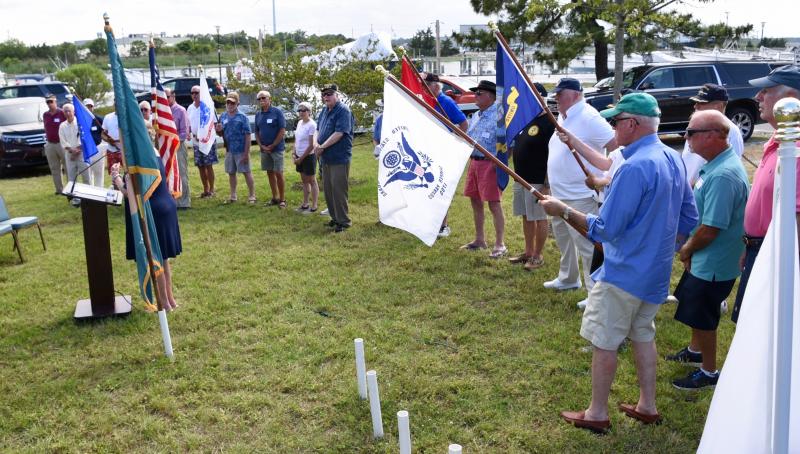 Veterans of branches of the military stand in line behind their flags during the seventh annual Salute Our Veterans ceremony May 27 at Lewes Yacht Club.