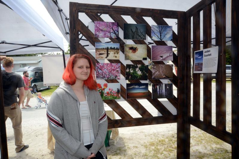 Jaiden Scarlett stands with her artwork, created with the Dewey Artist Collaborative’s Inspired Artist program. DBP Arts Fest