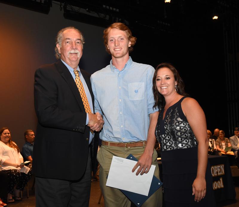 Jack Dennis, center, is shown with Lou Norbeck of the Lou Norbeck Student-Athlete Scholarship and Cape Principal Nikki Miller.