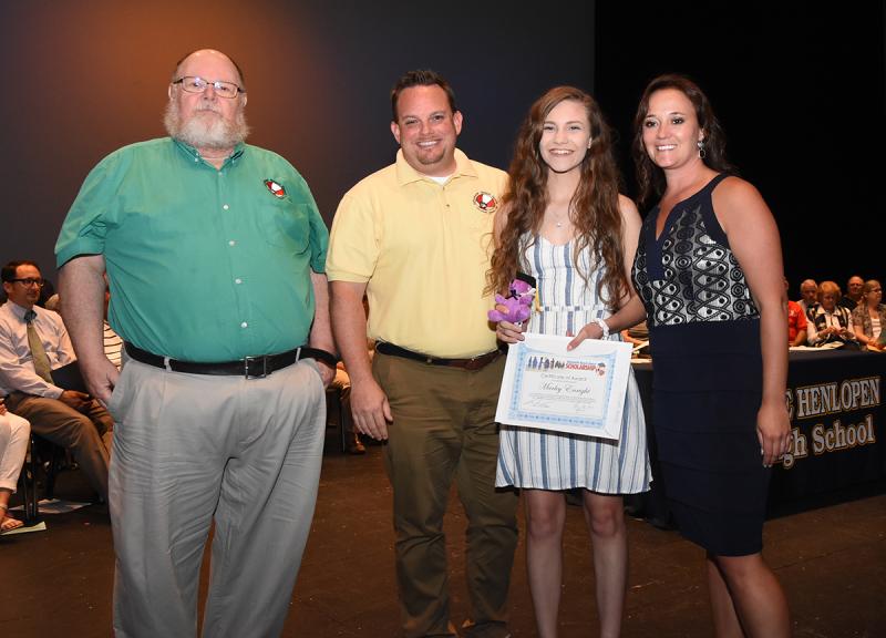 Marley Enright is shown with (l-r) Dickie Mitchell and Christopher Berg of Rehoboth Beach Bears, and Cape Principal Nikki Miller.